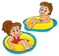 Image showing Children in swim rings image 1