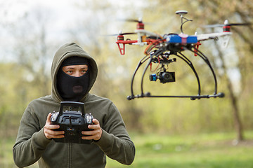 Image showing Man flying with the drone