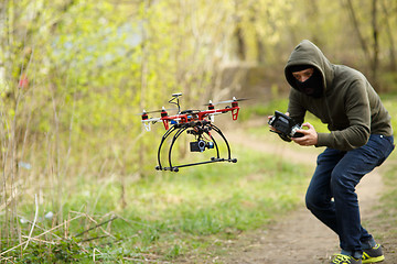 Image showing Man flying with the drone