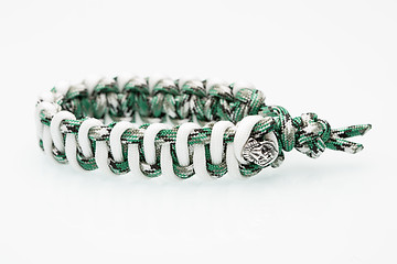 Image showing green braided bracelet on white background