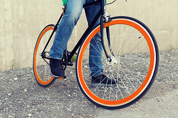 Image showing close up of man on fixed gear bike on city street