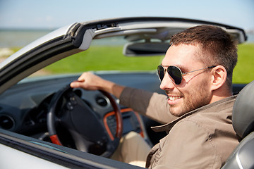 Image showing happy man driving cabriolet car outdoors