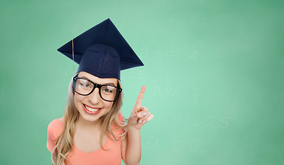 Image showing smiling young student woman in mortarboard