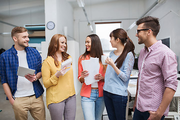 Image showing creative team on coffee break talking at office