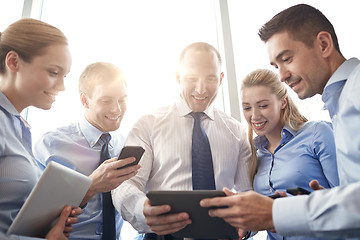 Image showing business people with tablet pc and smartphones