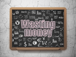 Image showing Banking concept: Wasting Money on School board background