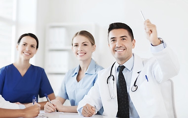 Image showing group of happy doctors on conference at hospital