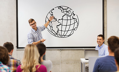 Image showing group of students and teacher at white board