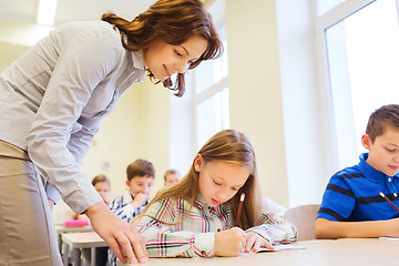 Image showing group of school kids writing test in classroom