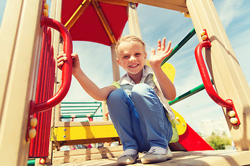 Image showing happy little girl climbing on children playground