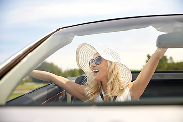 Image showing happy man and woman driving in cabriolet car