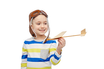 Image showing happy little boy in aviator hat with airplane
