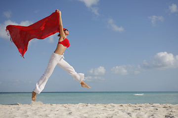 Image showing Woman jumping on the Beach