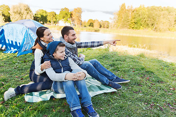 Image showing happy family with tent at camp site