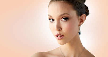 Image showing close up of beautiful woman face with earring