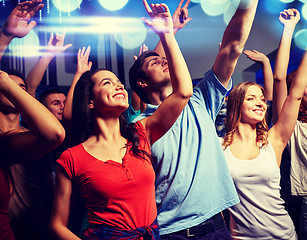 Image showing smiling friends at concert in club