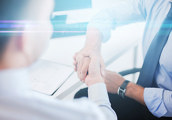 Image showing businessmen shaking hands in office