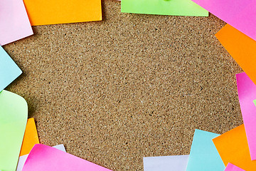 Image showing close up of blank paper stickers on cork board