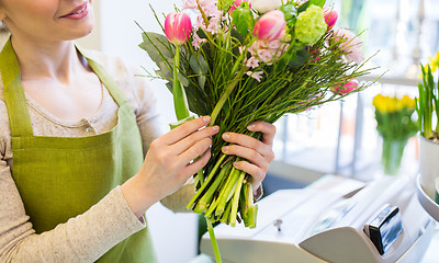 Image showing close up of woman making bunch at flower shop