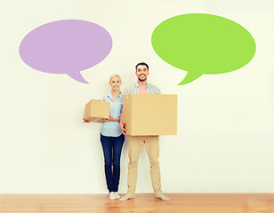 Image showing couple with cardboard boxes moving to new home