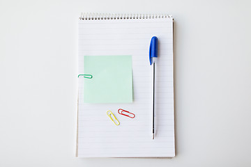 Image showing close up of notebook with pen and bank paper