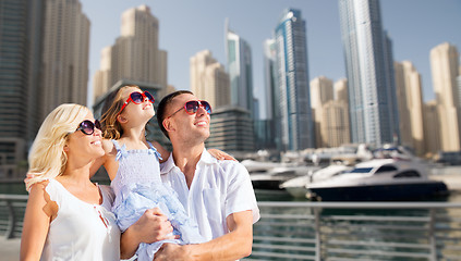 Image showing happy family over dubai city street background