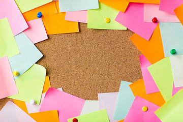 Image showing close up of blank paper stickers on cork board