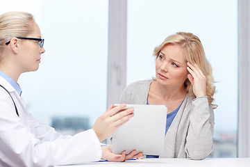 Image showing doctor with tablet pc and ill woman at hospital