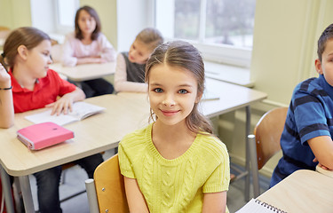 Image showing student girl with group of school kids in class