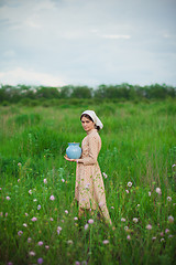 Image showing The healthy rural life. The woman in the green field