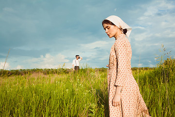 Image showing The healthy rural life. The woman and man in the green field