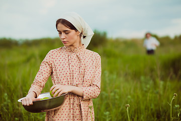 Image showing The healthy rural life. The woman in the green field