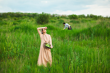 Image showing The healthy rural life. The woman in the green field