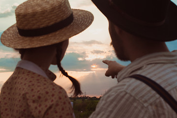 Image showing Young couple in love in the meadow