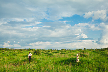 Image showing The healthy rural life. The woman and man in the green field