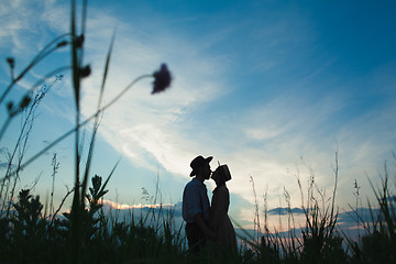 Image showing Young couple in love in the meadow