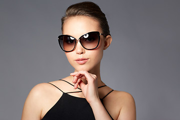 Image showing beautiful young woman in elegant black sunglasses