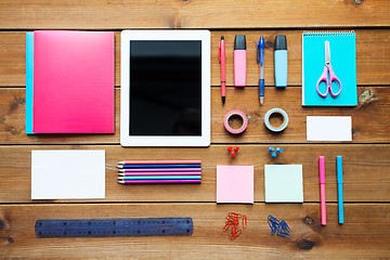 Image showing close up of school supplies and tablet pc