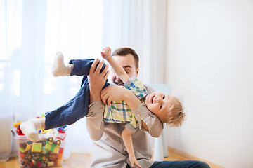 Image showing father with son playing and having fun at home