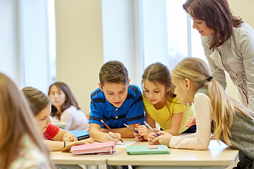 Image showing group of school kids writing test in classroom