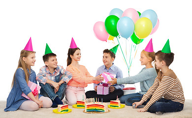 Image showing happy children giving presents at birthday party