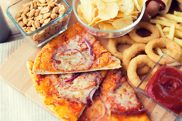 Image showing close up of fast food snacks and drink on table