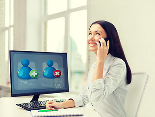 Image showing smiling businesswoman or student with smartphone