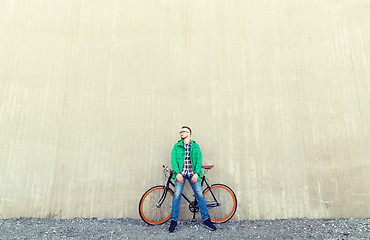 Image showing happy young hipster man with fixed gear bike