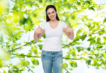 Image showing happy young woman or teenage girl in white t-shirt