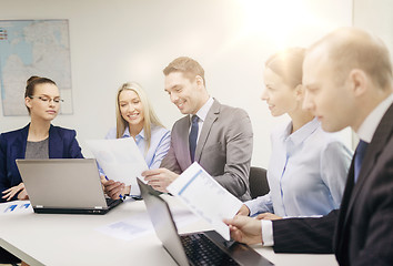 Image showing business team with laptop having discussion