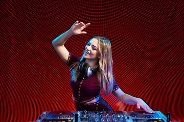 Image showing DJ girl on decks at the party