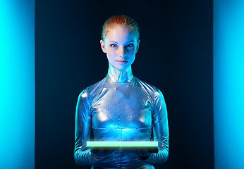 Image showing Futuristic young woman in silver clothing