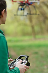 Image showing Man controling a drone.