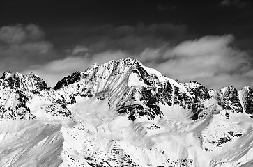 Image showing Black and white snowy mountains at sun day